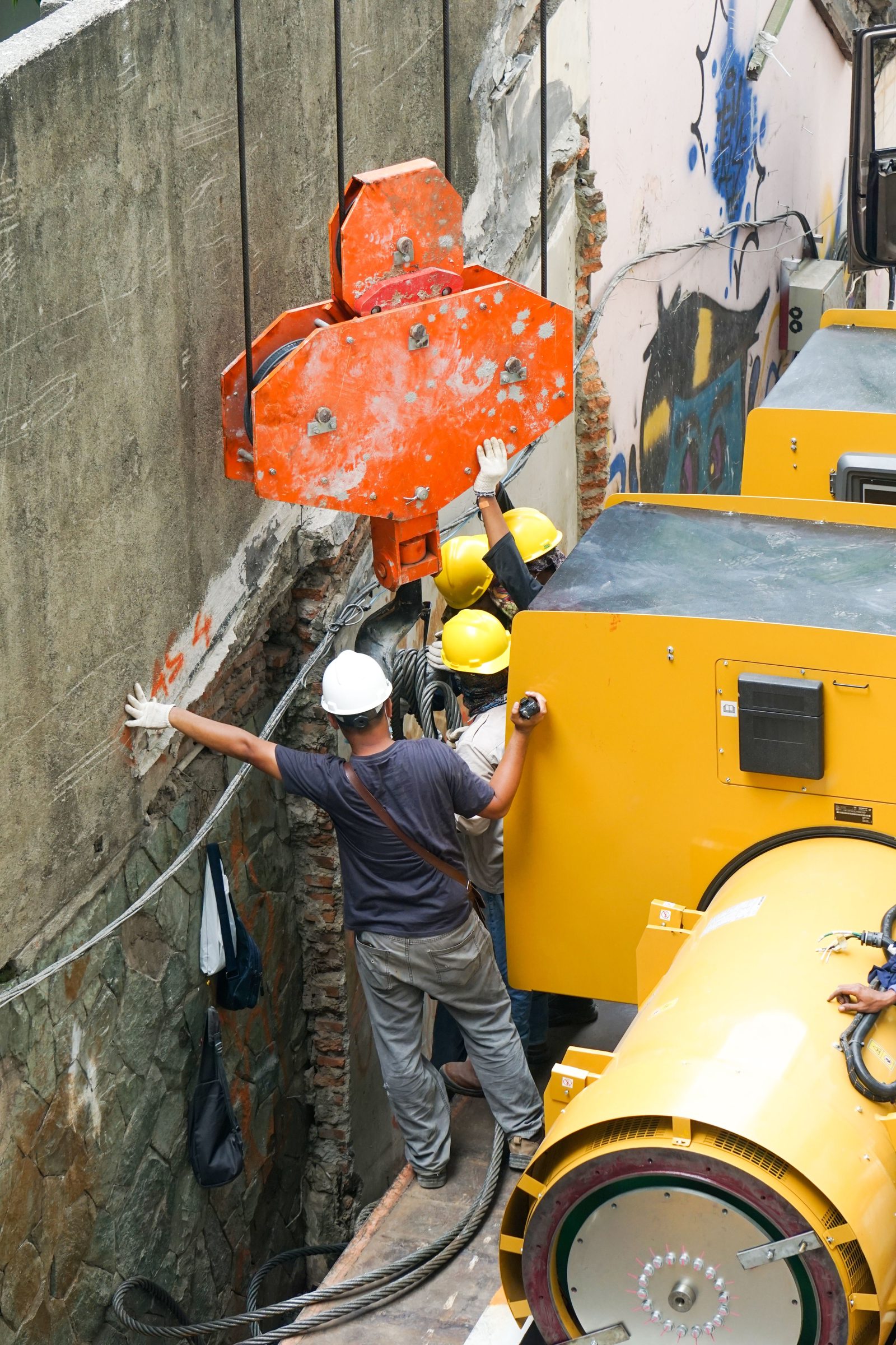 Worker on rope access equipment on a building facade